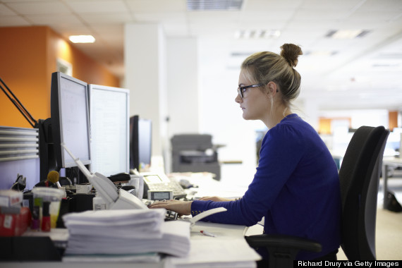 Young woman using computer in office